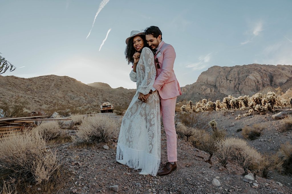 Couple hug and laugh in Nevada desert before they elope
