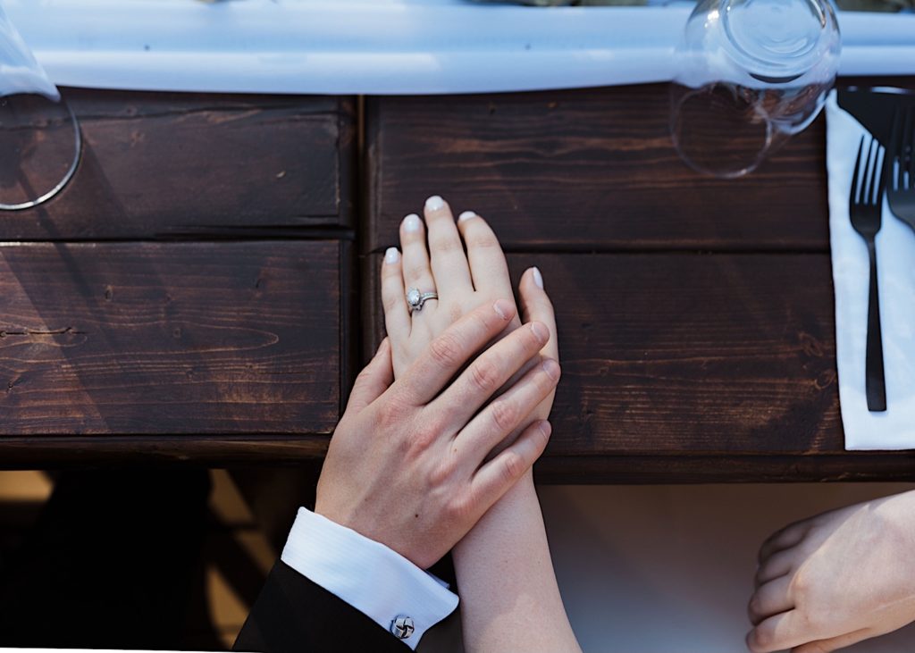 Bride and groom show off wedding ring at Wisconsin elopement reception